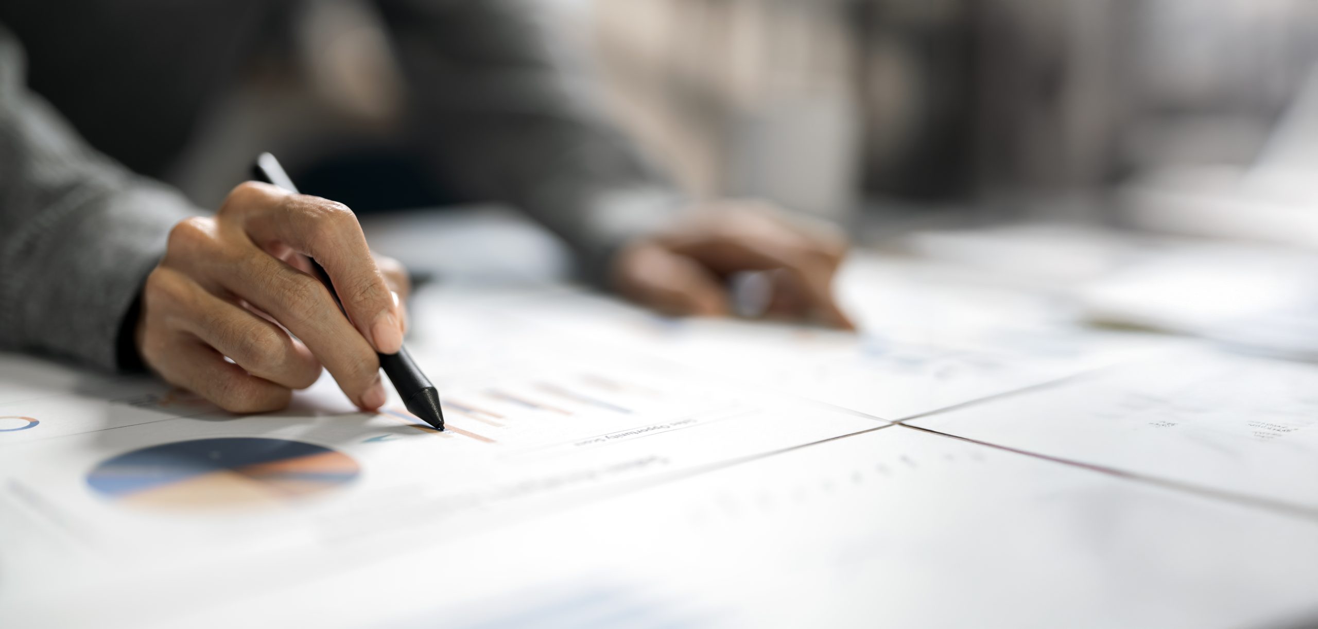 Closeup hand of Business men analyze company results and profits